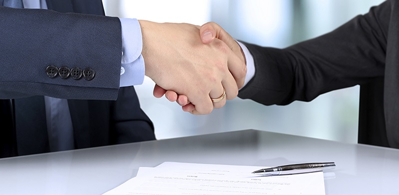 Hands shake - signed employment contract